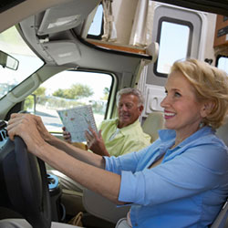 couple driving an RV