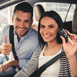 Couple with new car and keys