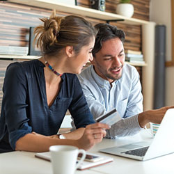 happy couple working on computer