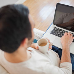 man using computer at home