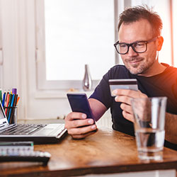 man paying with credit card online