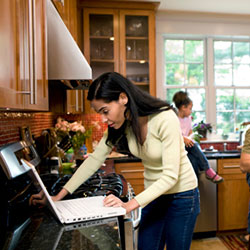 woman using computer at home